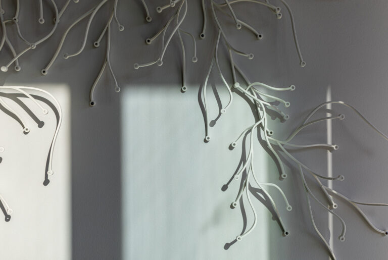 Abstract wall installation suggesting interconnected pathways, symbolising planning coordination and strategy