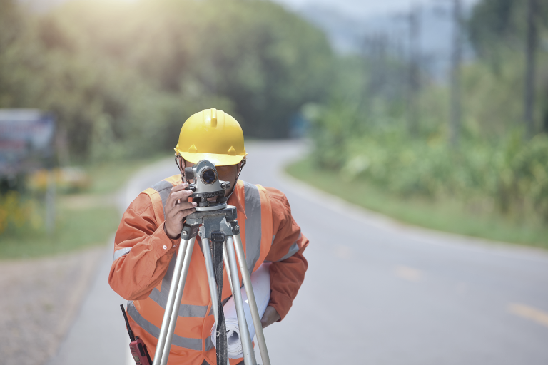 Surveyor conducting a measured survey with equipment on site, part of Architect Your Home’s process to prepare accurate project plans